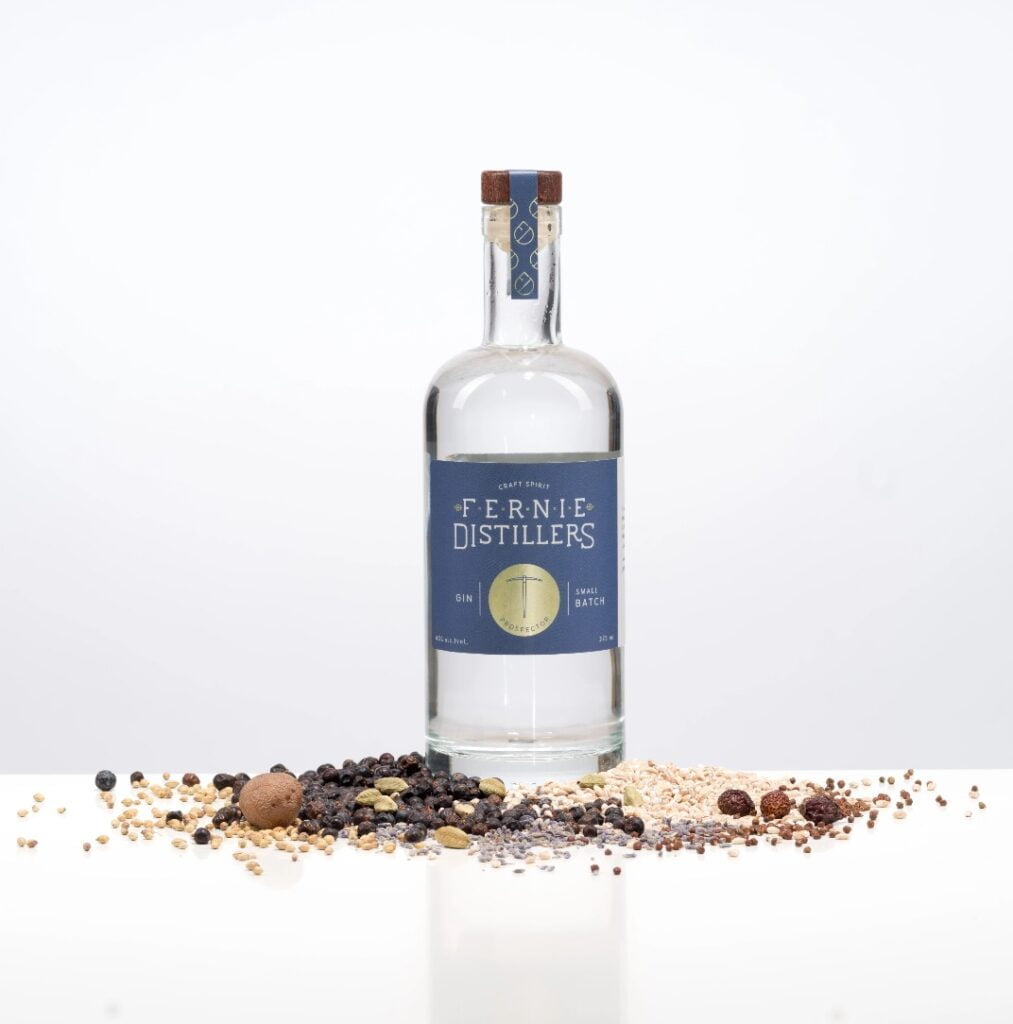 Product photography gin bottle and grains