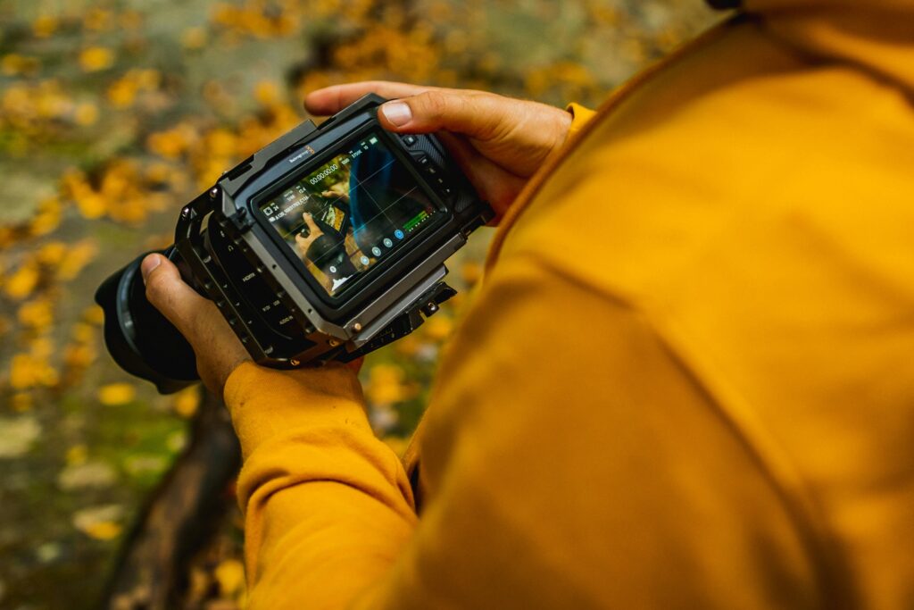 digital content creator reviewing image on back of camera.