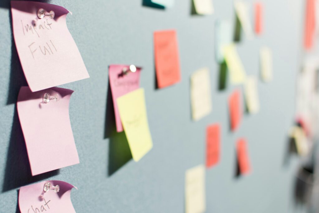 Post It notes on a wall, suggesting a brainstorming session for a how to build a marketing strategy